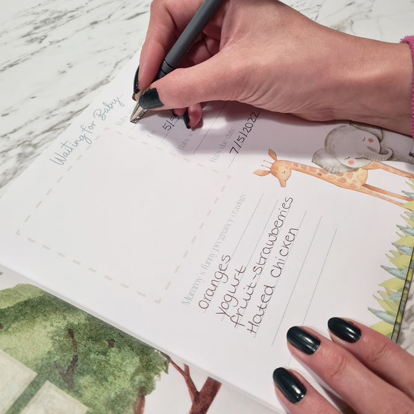 Baby memory book open showing milestone pages